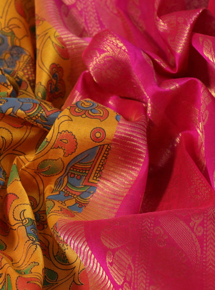 Silk cotton saree mustard yellow and pink with allover kalamkari prints and paisley zari woven korvai border