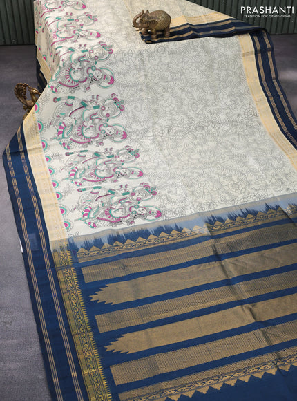 Silk cotton saree cream and peacock blue with allover kalamkari prints and rettapet zari woven korvai border