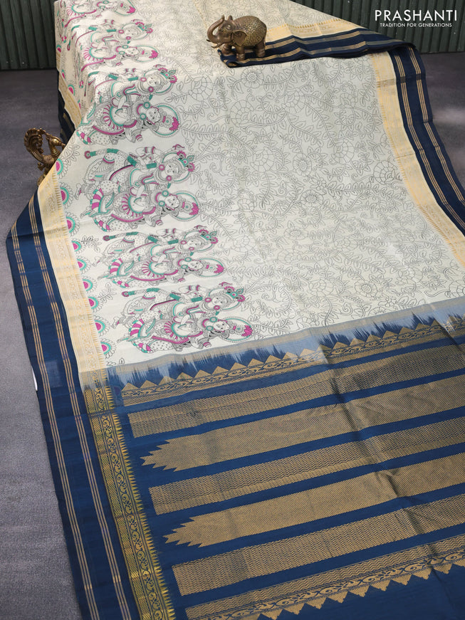 Silk cotton saree cream and peacock blue with allover kalamkari prints and rettapet zari woven korvai border