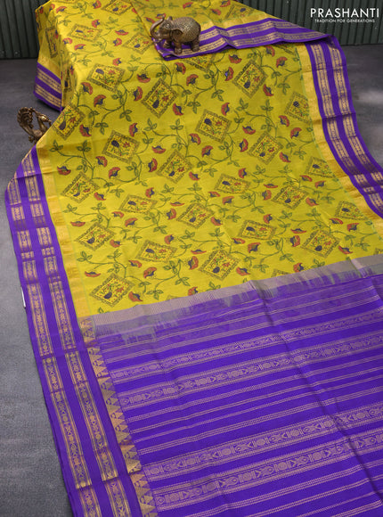 Silk cotton saree lime yellow and violet with allover kalamkari prints and rettapet zari woven korvai border