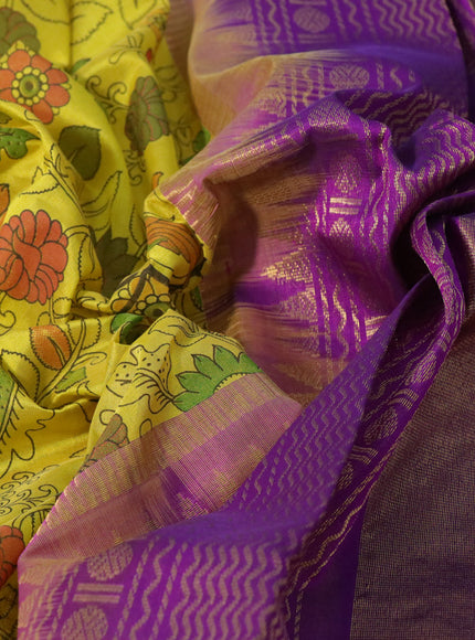 Silk cotton saree lime yellow and purple with allover kalamkari prints and rettapet zari woven korvai border