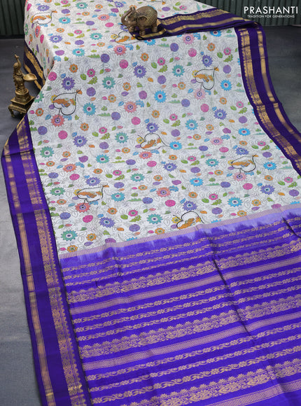 Silk cotton saree off white and blue with allover kalamkari prints and rettapet zari woven korvai border