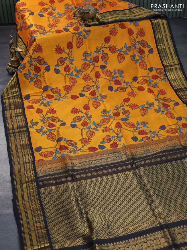 Silk cotton saree mustard yellow and black with allover kalamkari prints and zari woven korvai border