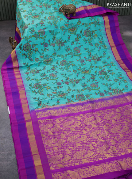 Silk cotton saree light blue and purple with allover kalamkari prints and temple deisgn zari woven simple border