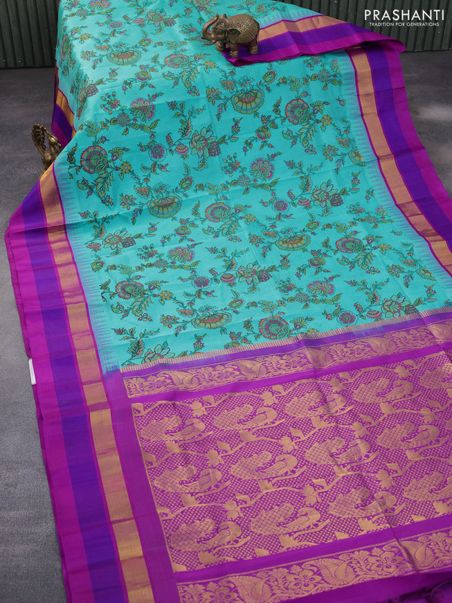 Silk cotton saree light blue and purple with allover kalamkari prints and temple deisgn zari woven simple border