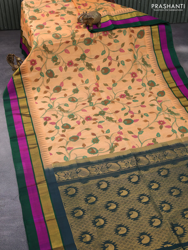 Silk cotton saree pale orange and green with allover kalamkari prints and temple deisgn zari woven simple border