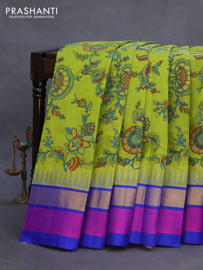 Silk cotton saree light green and blue with allover kalamkari prints and temple deisgn zari woven simple border