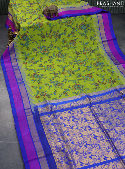 Silk cotton saree light green and blue with allover kalamkari prints and temple deisgn zari woven simple border