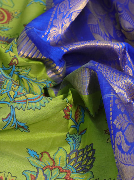 Silk cotton saree light green and blue with allover kalamkari prints and temple deisgn zari woven simple border