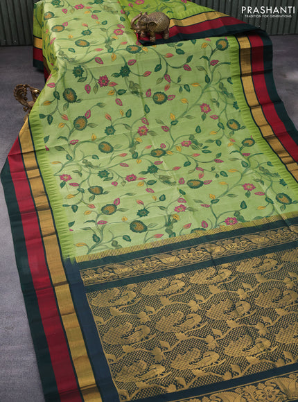 Silk cotton saree pastel green and dark green with allover kalamkari prints and temple deisgn zari woven simple border