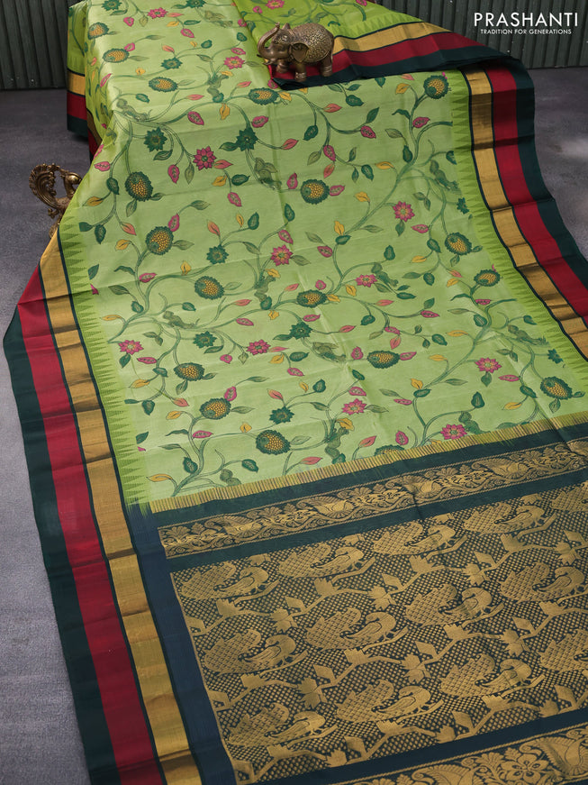 Silk cotton saree pastel green and dark green with allover kalamkari prints and temple deisgn zari woven simple border