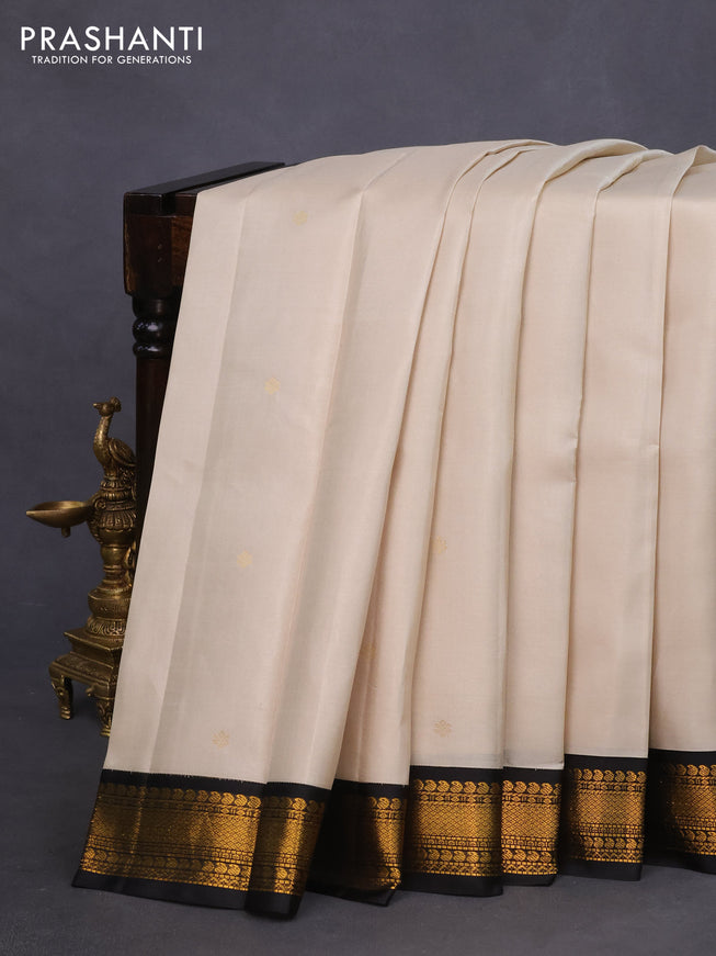 Pure kanchipuram silk saree cream and black with zari woven buttas and zari woven korvai border