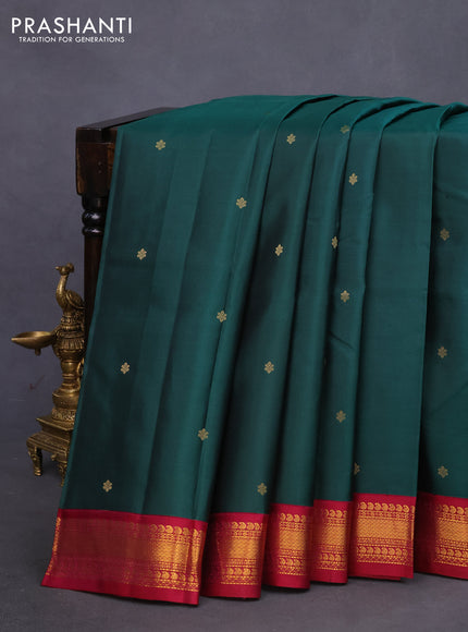 Pure kanchipuram silk saree dark green and dark magenta pink with zari woven buttas and zari woven korvai border