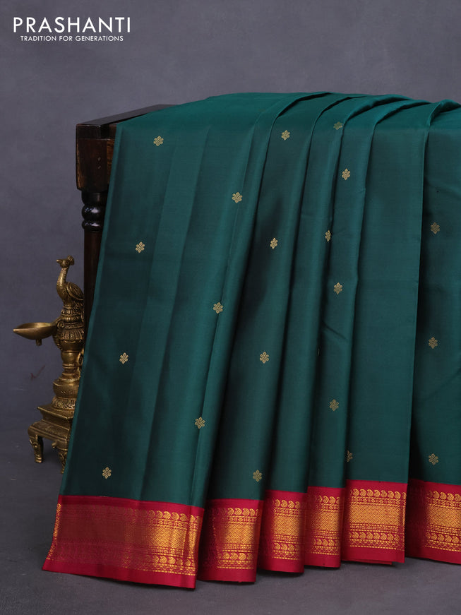 Pure kanchipuram silk saree dark green and dark magenta pink with zari woven buttas and zari woven korvai border