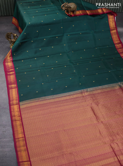 Pure kanchipuram silk saree dark green and dark magenta pink with zari woven buttas and zari woven korvai border