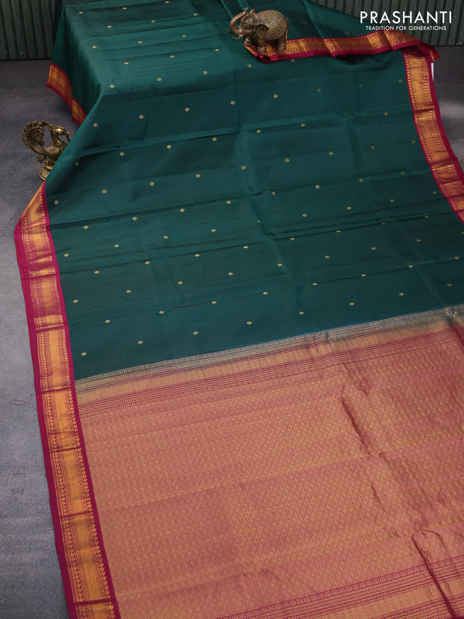 Pure kanchipuram silk saree dark green and dark magenta pink with zari woven buttas and zari woven korvai border