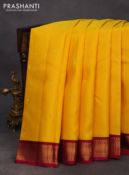 Pure kanchipuram silk saree mango yellow and dark magenta pink with zari woven buttas and zari woven korvai border