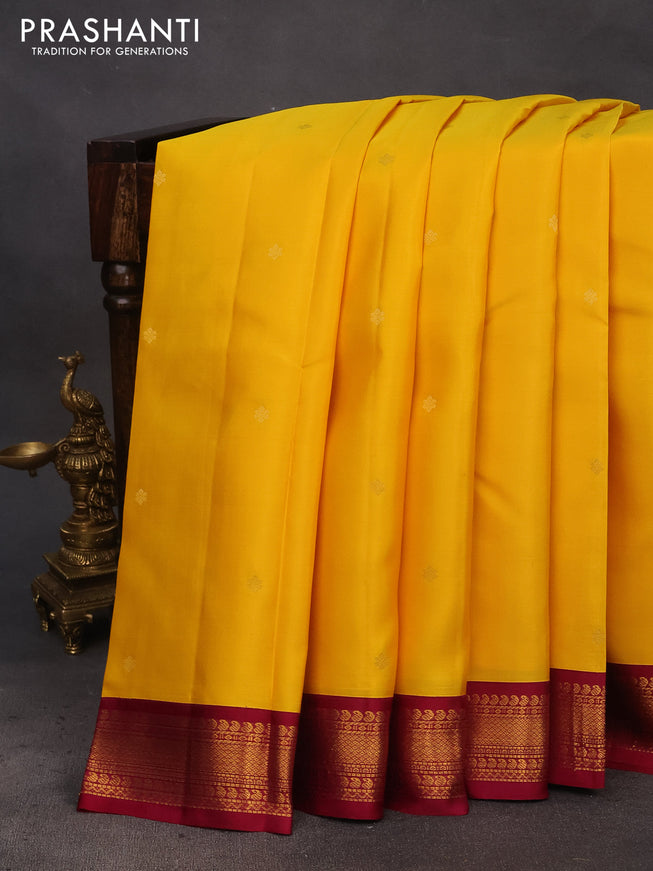 Pure kanchipuram silk saree mango yellow and dark magenta pink with zari woven buttas and zari woven korvai border