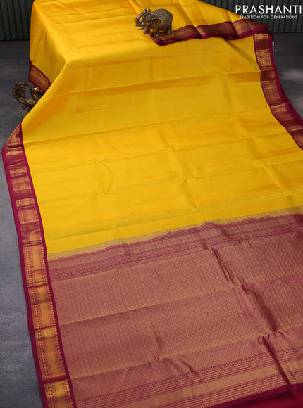 Pure kanchipuram silk saree mango yellow and dark magenta pink with zari woven buttas and zari woven korvai border