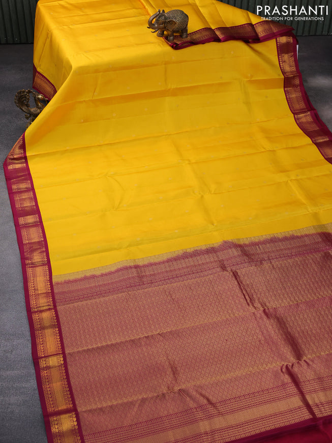 Pure kanchipuram silk saree mango yellow and dark magenta pink with zari woven buttas and zari woven korvai border