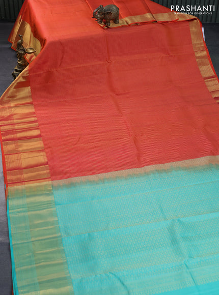 Pure kanchipuram silk saree dual shade of orange and teal blue with allover zari checked pattern and zari woven border