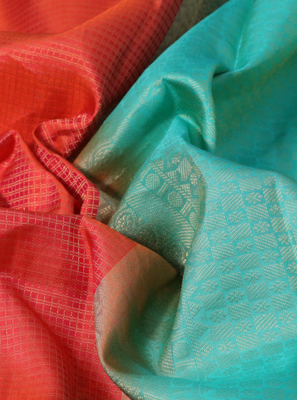 Pure kanchipuram silk saree dual shade of orange and teal blue with allover zari checked pattern and zari woven border