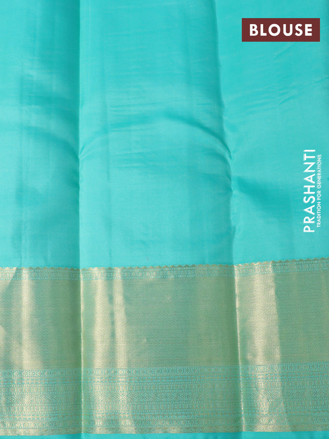 Pure kanchipuram silk saree dual shade of orange and teal blue with allover zari checked pattern and zari woven border