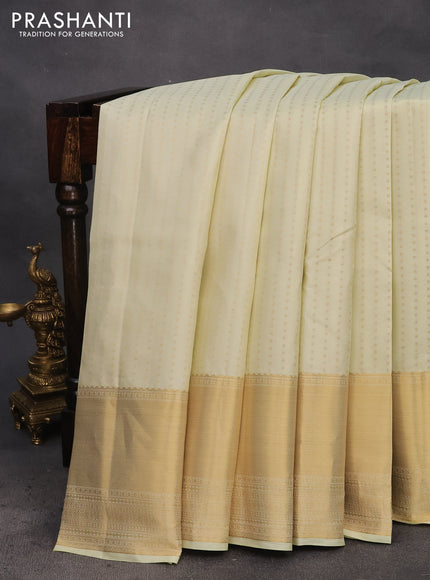 Pure kanchipuram silk saree cream with allover zari woven butta weaves and zari woven border