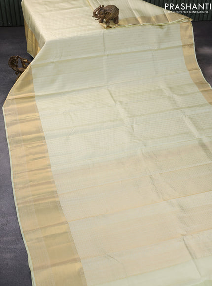 Pure kanchipuram silk saree cream with allover zari woven butta weaves and zari woven border