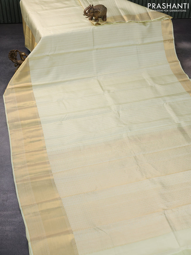 Pure kanchipuram silk saree cream with allover zari woven butta weaves and zari woven border