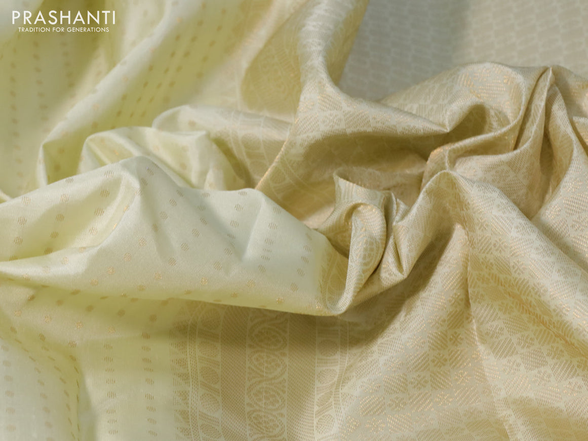 Pure kanchipuram silk saree cream with allover zari woven butta weaves and zari woven border