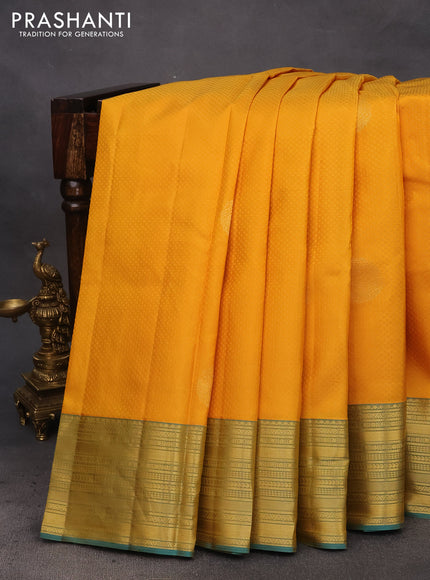 Pure kanchipuram silk saree mustard yellow and teal blue with allover self emboss & zari buttas and zari woven border