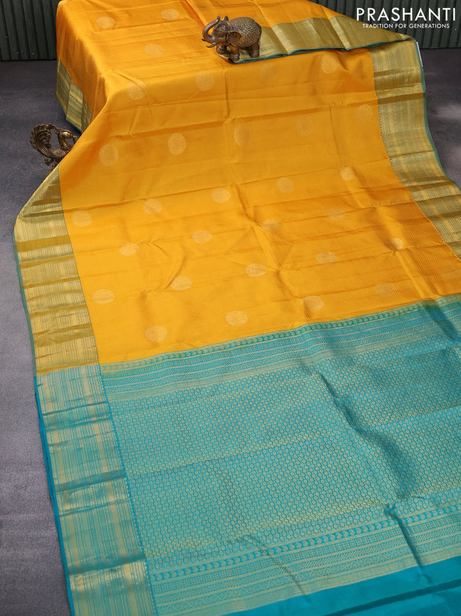 Pure kanchipuram silk saree mustard yellow and teal blue with allover self emboss & zari buttas and zari woven border