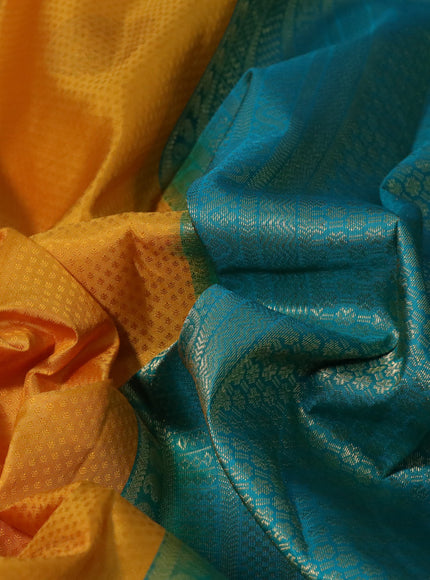 Pure kanchipuram silk saree mustard yellow and teal blue with allover self emboss & zari buttas and zari woven border