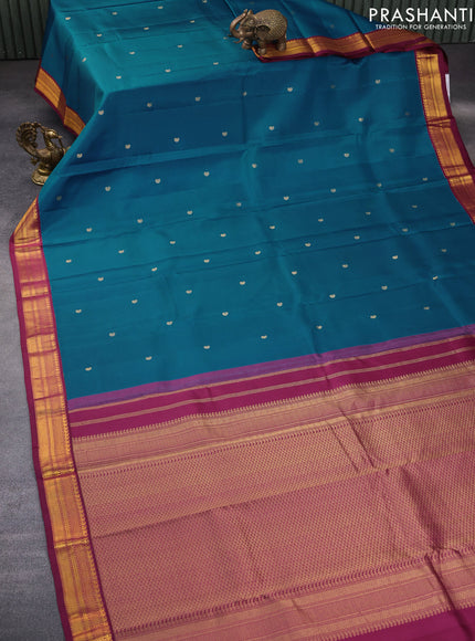 Pure kanchipuram silk saree peacock blue and dark magenta pink with zari woven buttas and zari woven korvai border