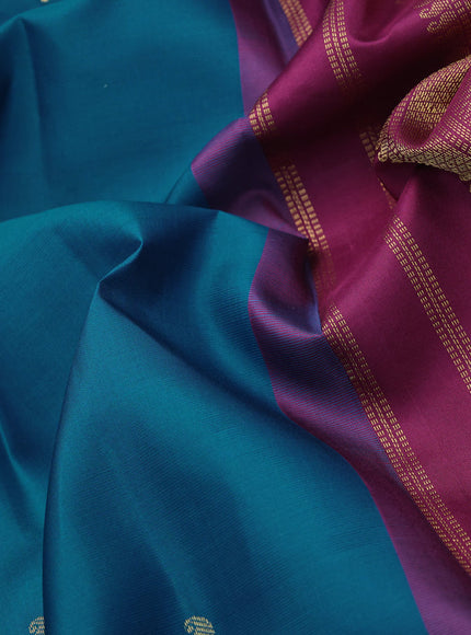 Pure kanchipuram silk saree peacock blue and dark magenta pink with zari woven buttas and zari woven korvai border