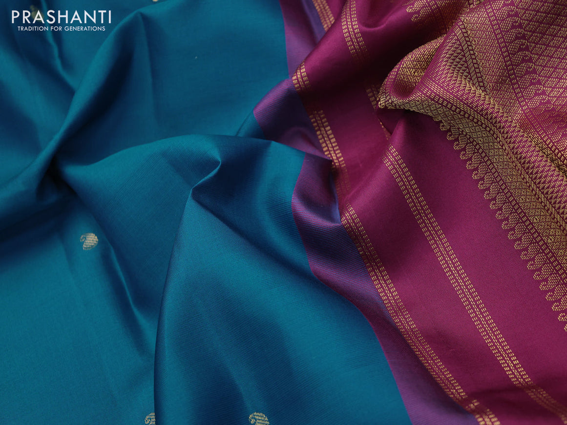 Pure kanchipuram silk saree peacock blue and dark magenta pink with zari woven buttas and zari woven korvai border