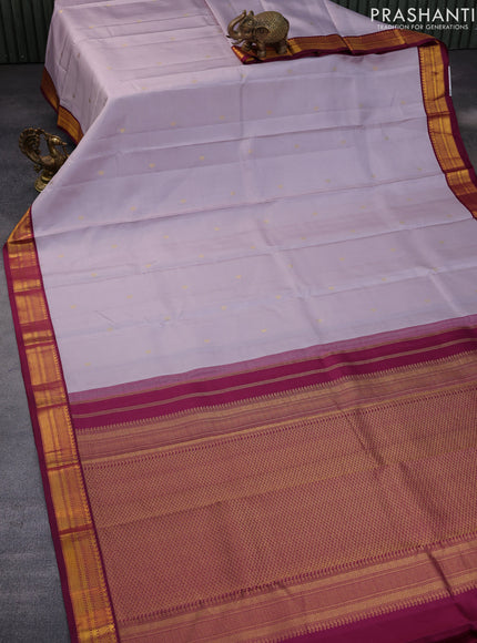 Pure kanchipuram silk saree pastel lavender and dark magenta pink with zari woven buttas and zari woven korvai border