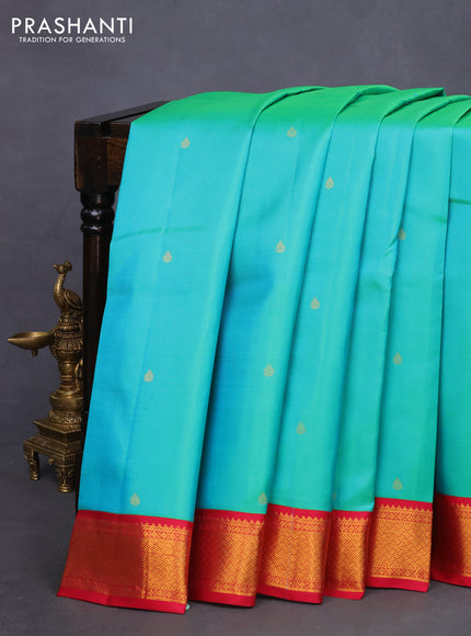 Pure kanchipuram silk saree dual shade of teal bluish green and pink with zari woven buttas and zari woven korvai border