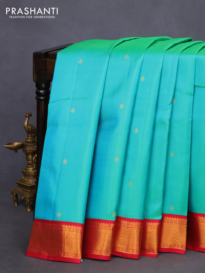 Pure kanchipuram silk saree dual shade of teal bluish green and pink with zari woven buttas and zari woven korvai border