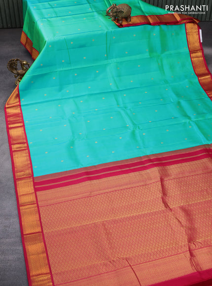 Pure kanchipuram silk saree dual shade of teal bluish green and pink with zari woven buttas and zari woven korvai border