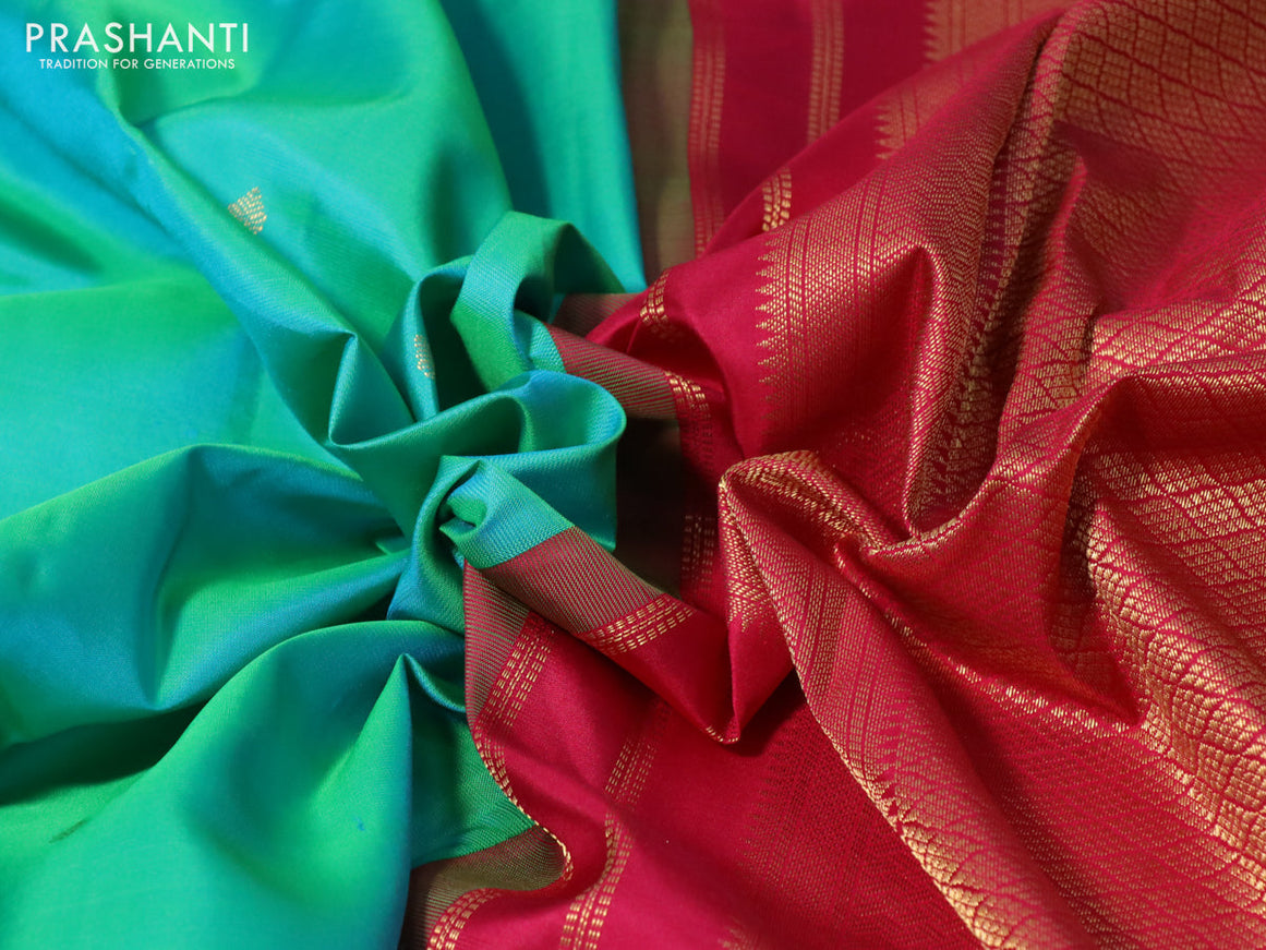 Pure kanchipuram silk saree dual shade of teal bluish green and pink with zari woven buttas and zari woven korvai border