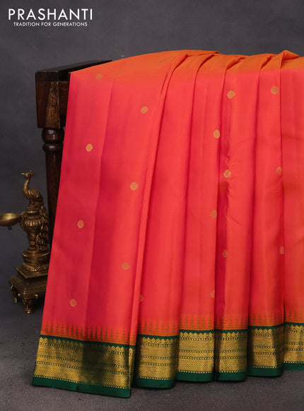 Pure kanchipuram silk saree dual shade of pinkish orange and green with zari woven buttas and temple design zari woven korvai border