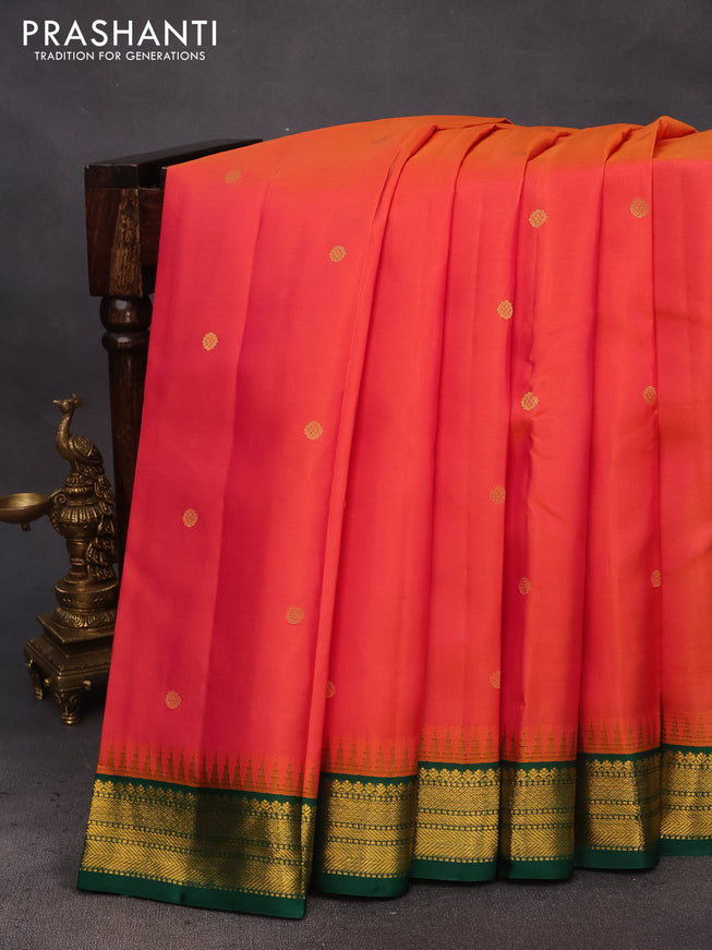 Pure kanchipuram silk saree dual shade of pinkish orange and green with zari woven buttas and temple design zari woven korvai border