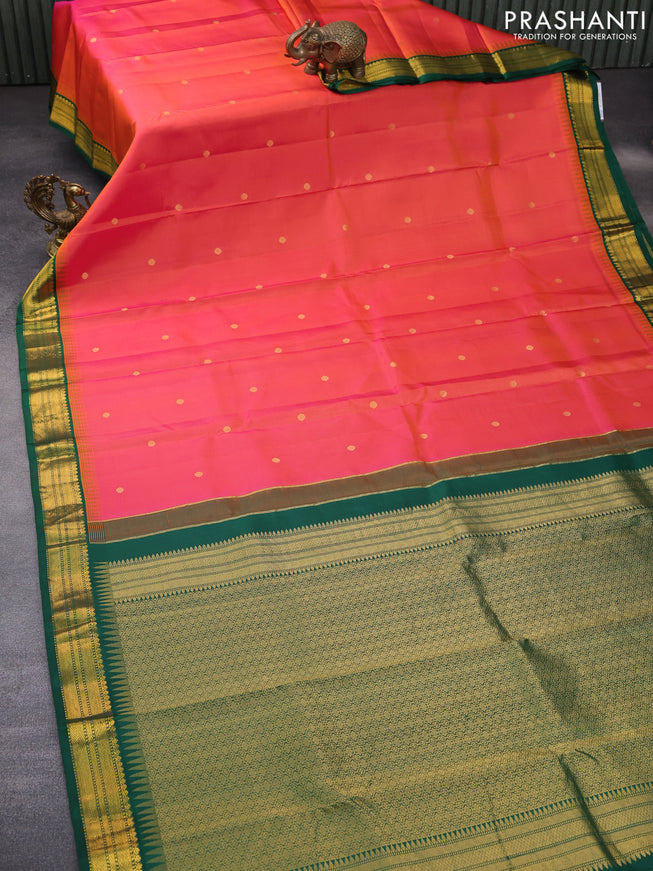 Pure kanchipuram silk saree dual shade of pinkish orange and green with zari woven buttas and temple design zari woven korvai border