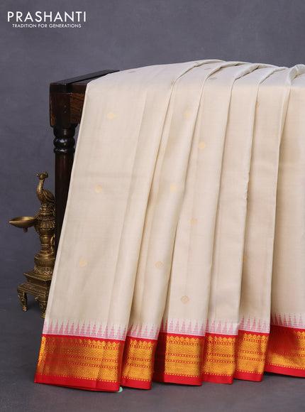 Pure kanchipuram silk saree cream and red with zari woven buttas and temple design zari woven korvai border