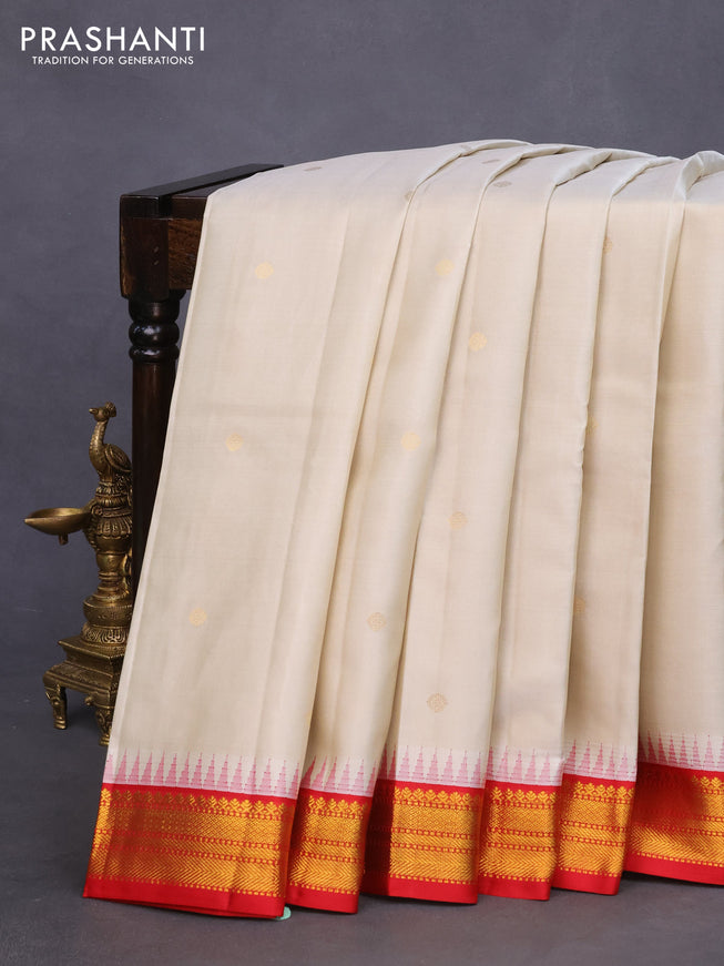 Pure kanchipuram silk saree cream and red with zari woven buttas and temple design zari woven korvai border