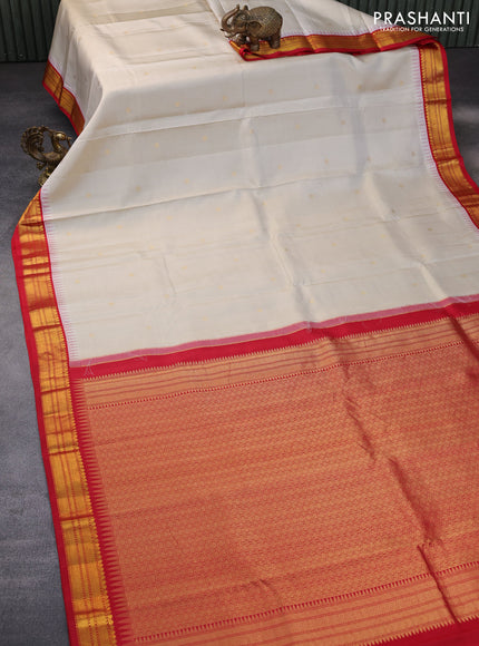 Pure kanchipuram silk saree cream and red with zari woven buttas and temple design zari woven korvai border