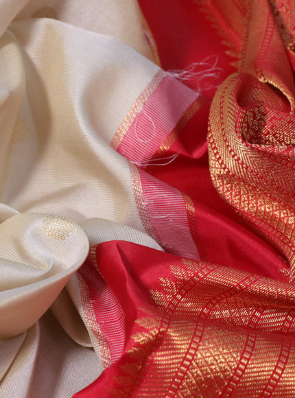 Pure kanchipuram silk saree cream and red with zari woven buttas and temple design zari woven korvai border