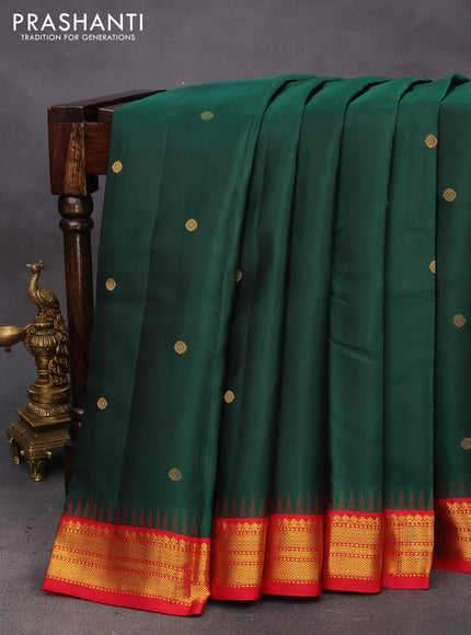 Pure kanchipuram silk saree green and red with zari woven buttas and temple design zari woven korvai border